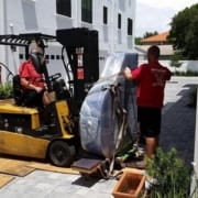 Two Men Carefully Moving a Piano | 3GuysMoving.com