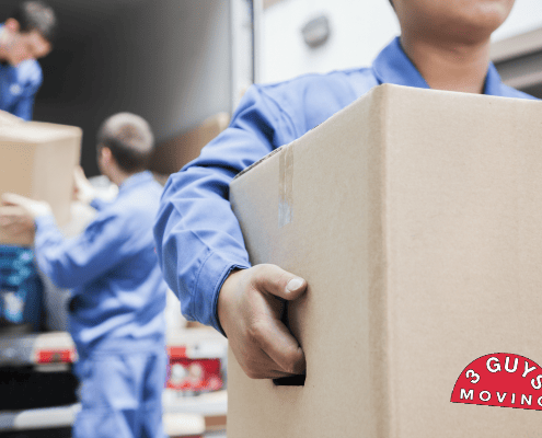 3 Reasons to Choose 3 Guys Moving 3 Movers Removing Boxes from Moving Truck | 3GuysMoving.com
