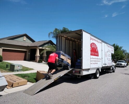 Supporting Your Movers 1 Carefully Loading Items into Moving Truck